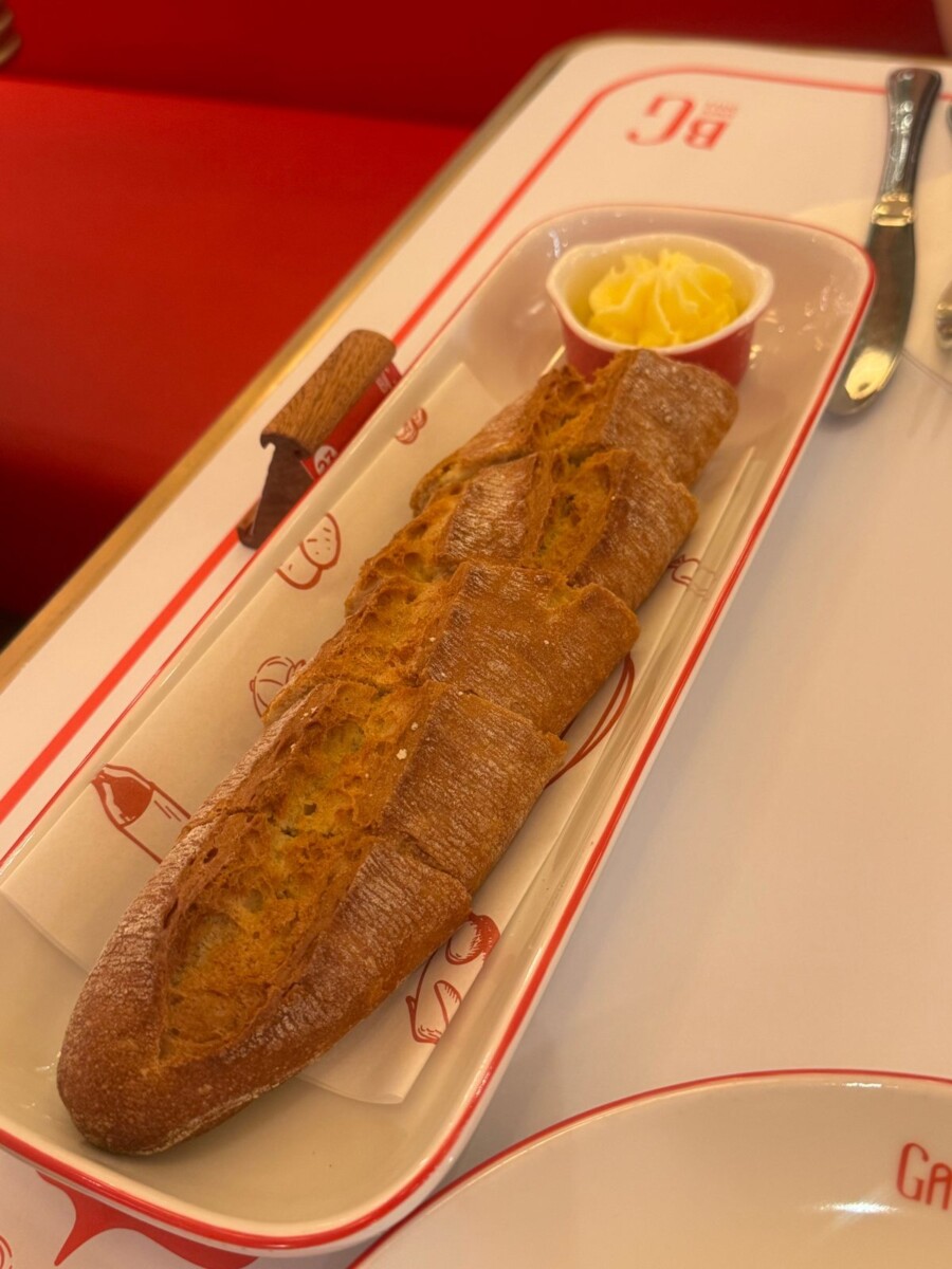 Warm French baguette slices served with a slab of butter