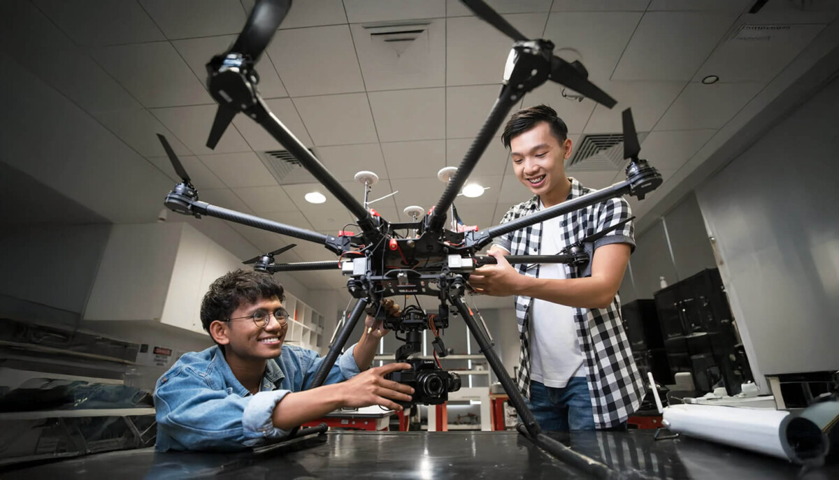 Republic Polytechnic students examining drones in a lab