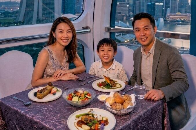 Family dining in a capsule at 165 Sky Dining by Singapore Flyer