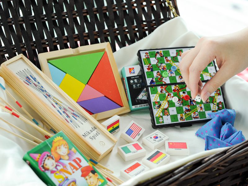 Relive the thrill of nostalgic games such as five stones, pick-up sticks, and snakes and ladders