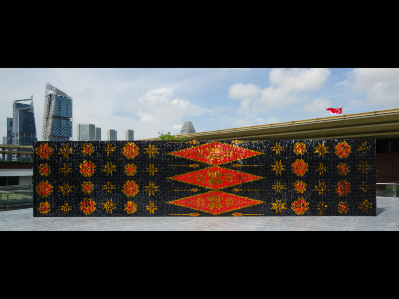 Installation view of GLISTEN wall with Songket patterns, National Gallery Singapore, 2024. Image Credit - National Gallery Singapore