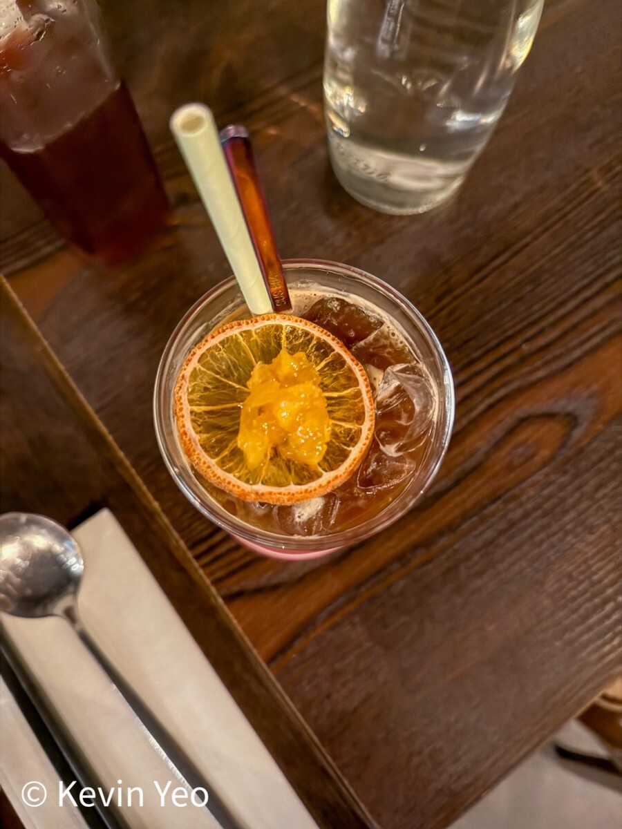 Espresso Orange drink with double ristretto and dehydrated orange slice at 808 Eating House