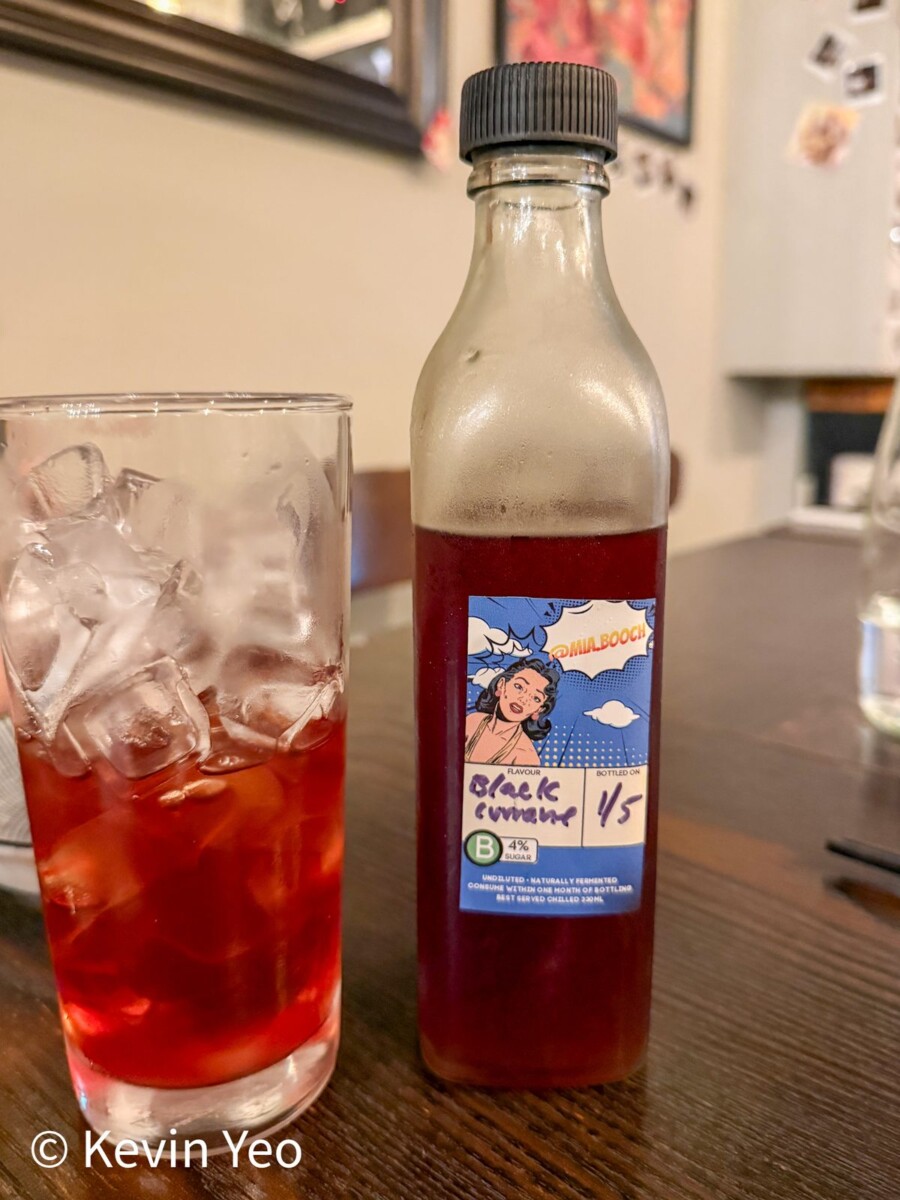 Mialbooch black currant kombucha bottle and glass at 808 Eating House