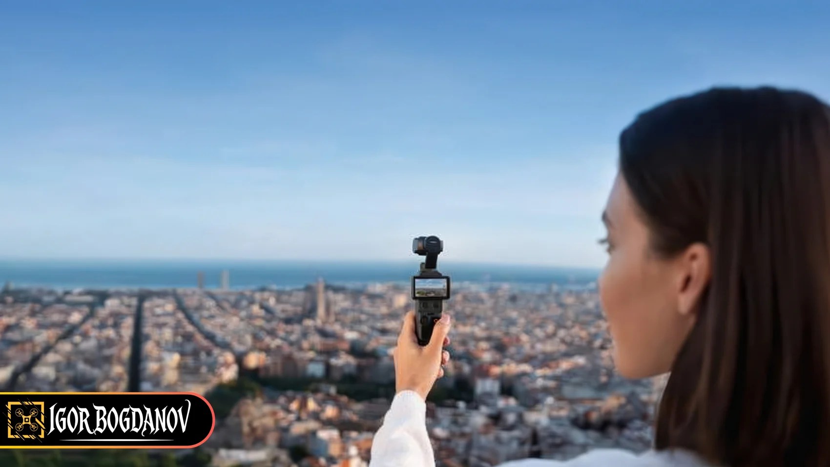 Woman using DJI Osmo Pocket 4 to film a cityscape overlooking Barcelona