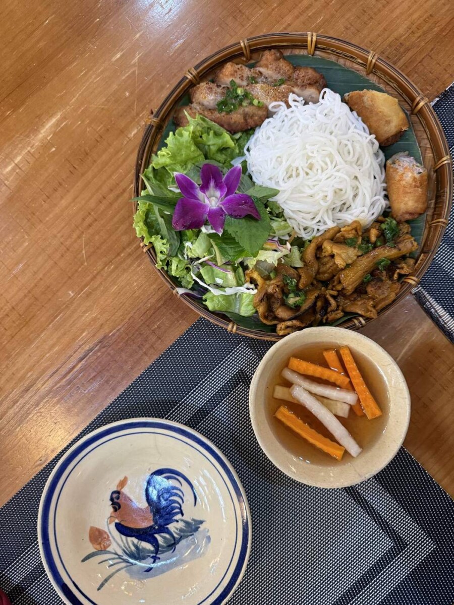 Dry vermicelli with grilled pork and spring roll, served with cold fish sauce dip at A Taste of Saigon