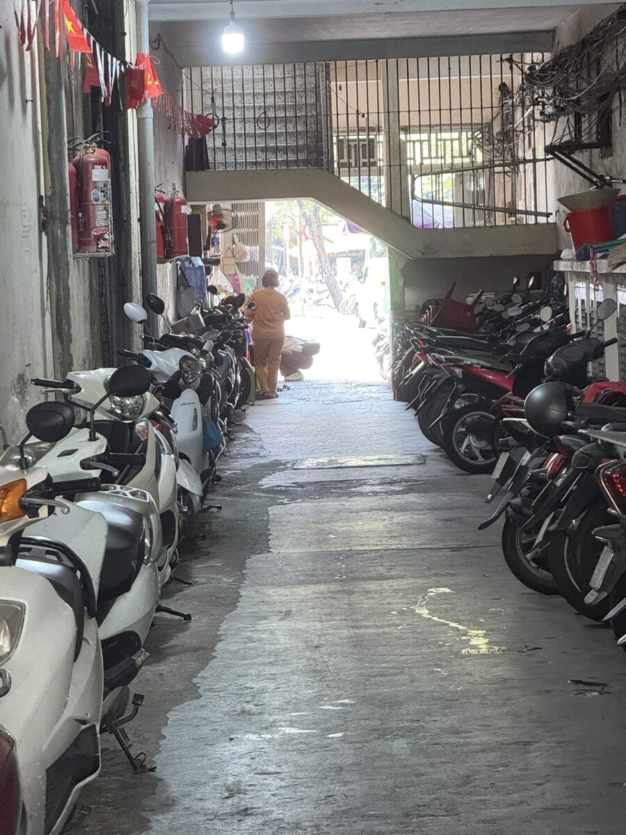 Motorbike-filled back alley leading to A Taste of Saigon restaurant in District 1