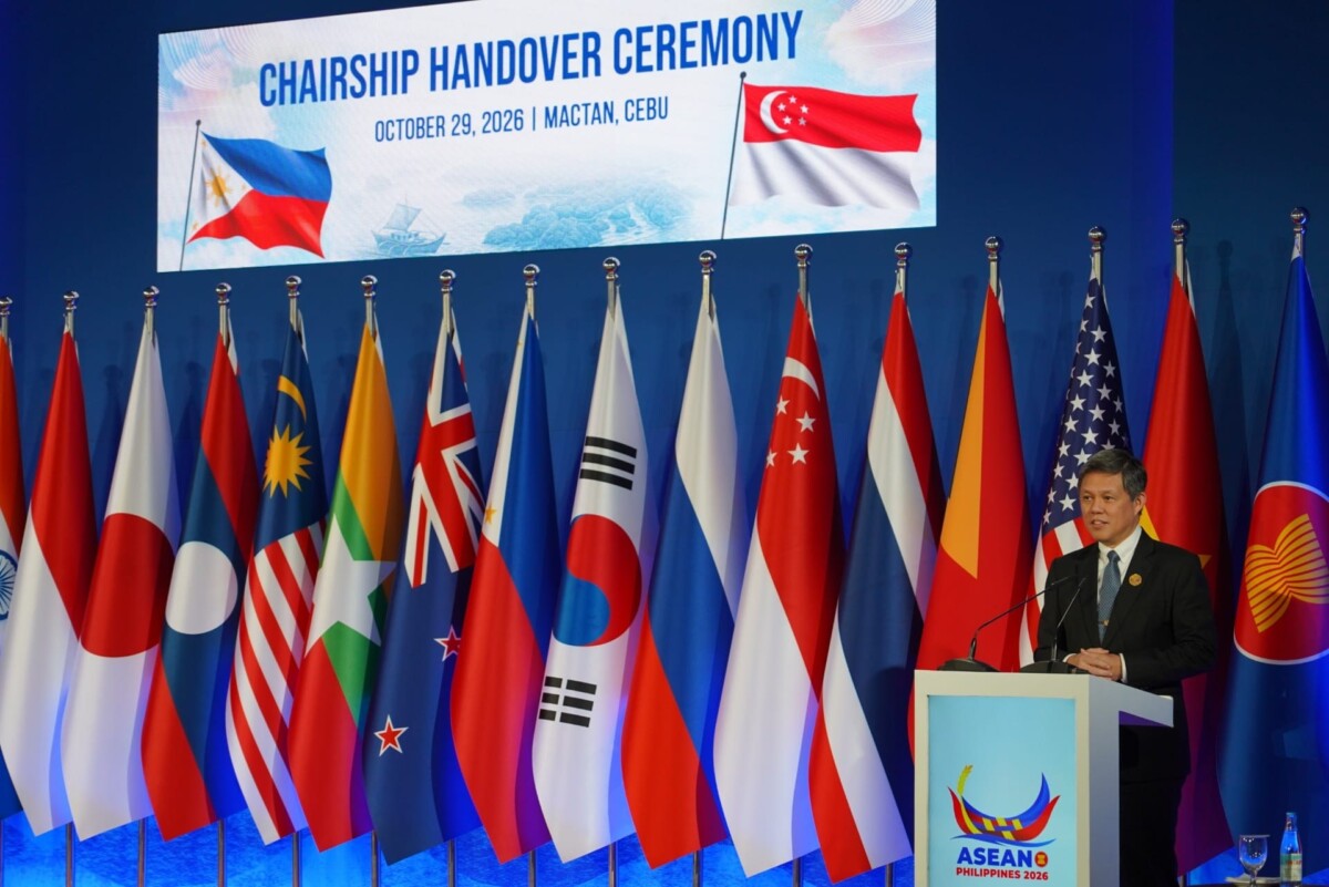 Chan Chun Sing speaks at a lectern at the ADMM-Plus chairmanship handover ceremony in Cebu