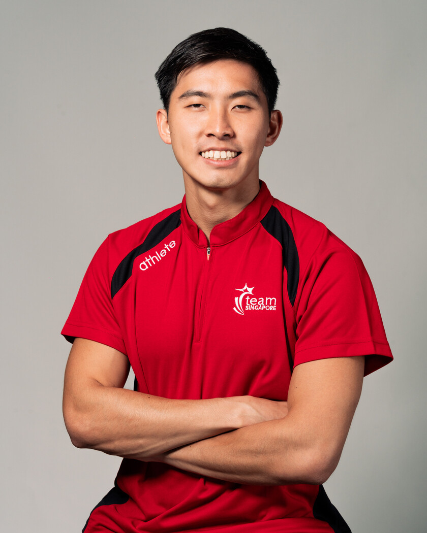 Team Singapore para sprinter James Ethan Ang in a red Team Singapore shirt