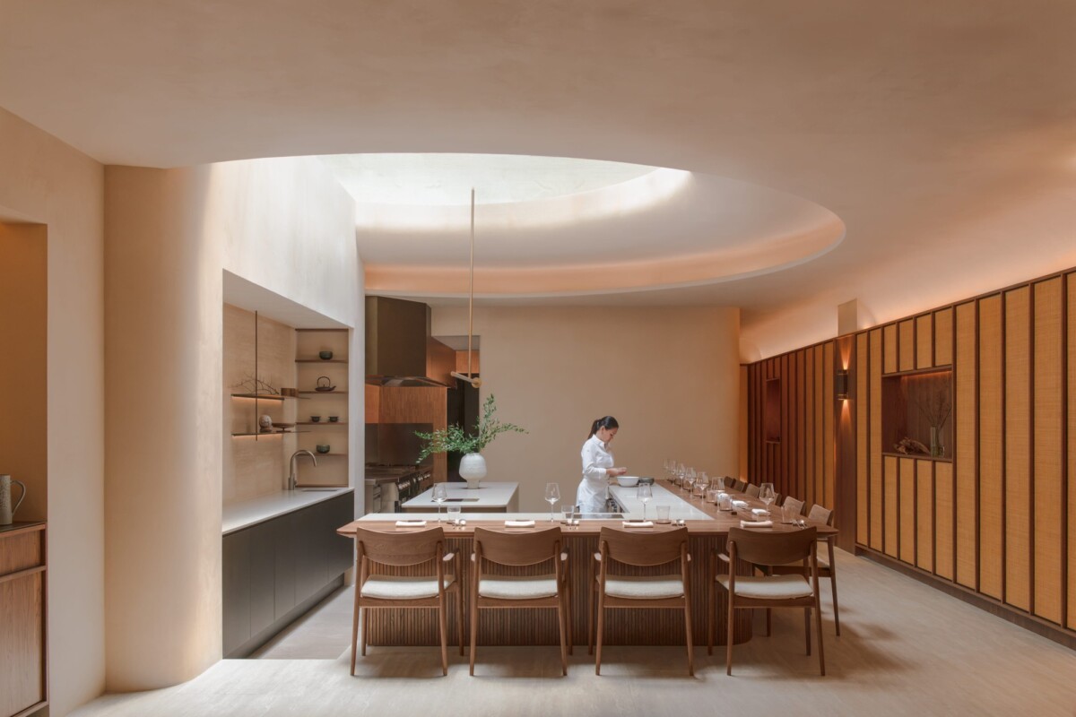 Árō dining room on Mohamed Sultan Road with walnut counter and rattan details