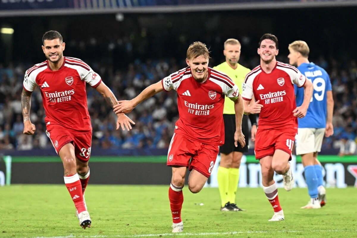 Martin Odegaard celebrates scoring against Napoli