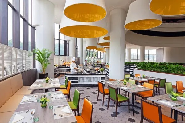 Atrium Restaurant dining room interior at Holiday Inn Singapore Atrium