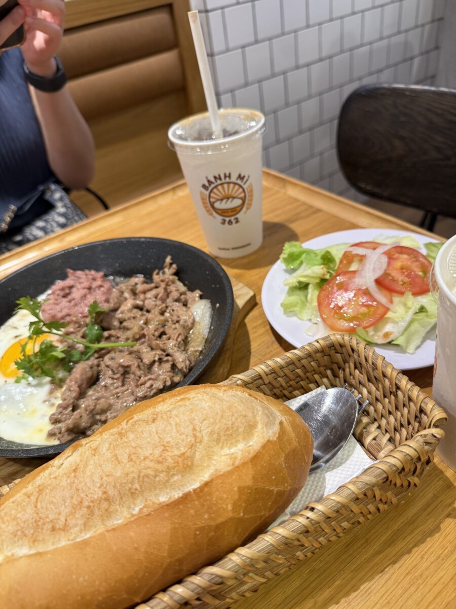 Bo Ne sizzling beef set at Banh Mi 362 Saigon with hot pan, baguette, salad and coconut coffee