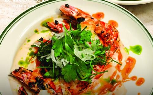 Grilled king tiger prawns with herb salad on onion purée at Barossa Steak & Grill