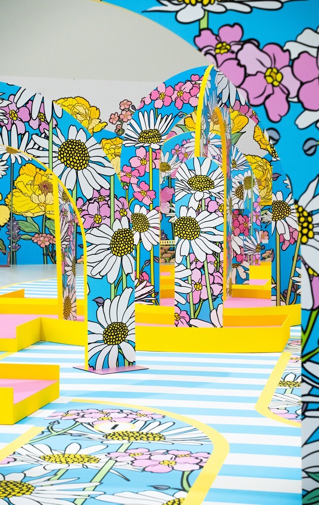 Oversized painted flowers and a swing inside Bloomyard at IMBA, Gardens by the Bay
