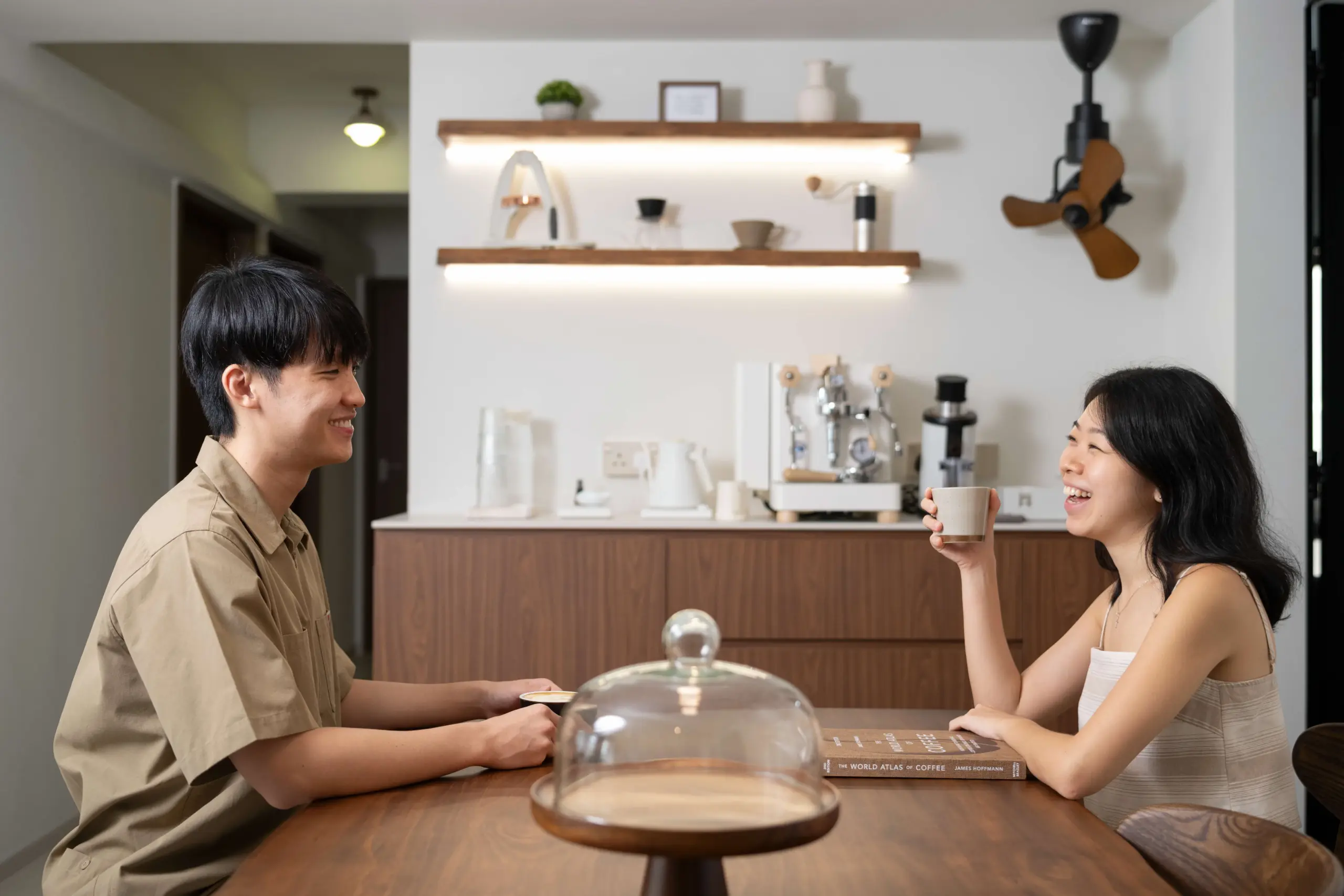 BTO income ceiling raised to $16,000 as a young couple sits in their HDB flat in Singapore