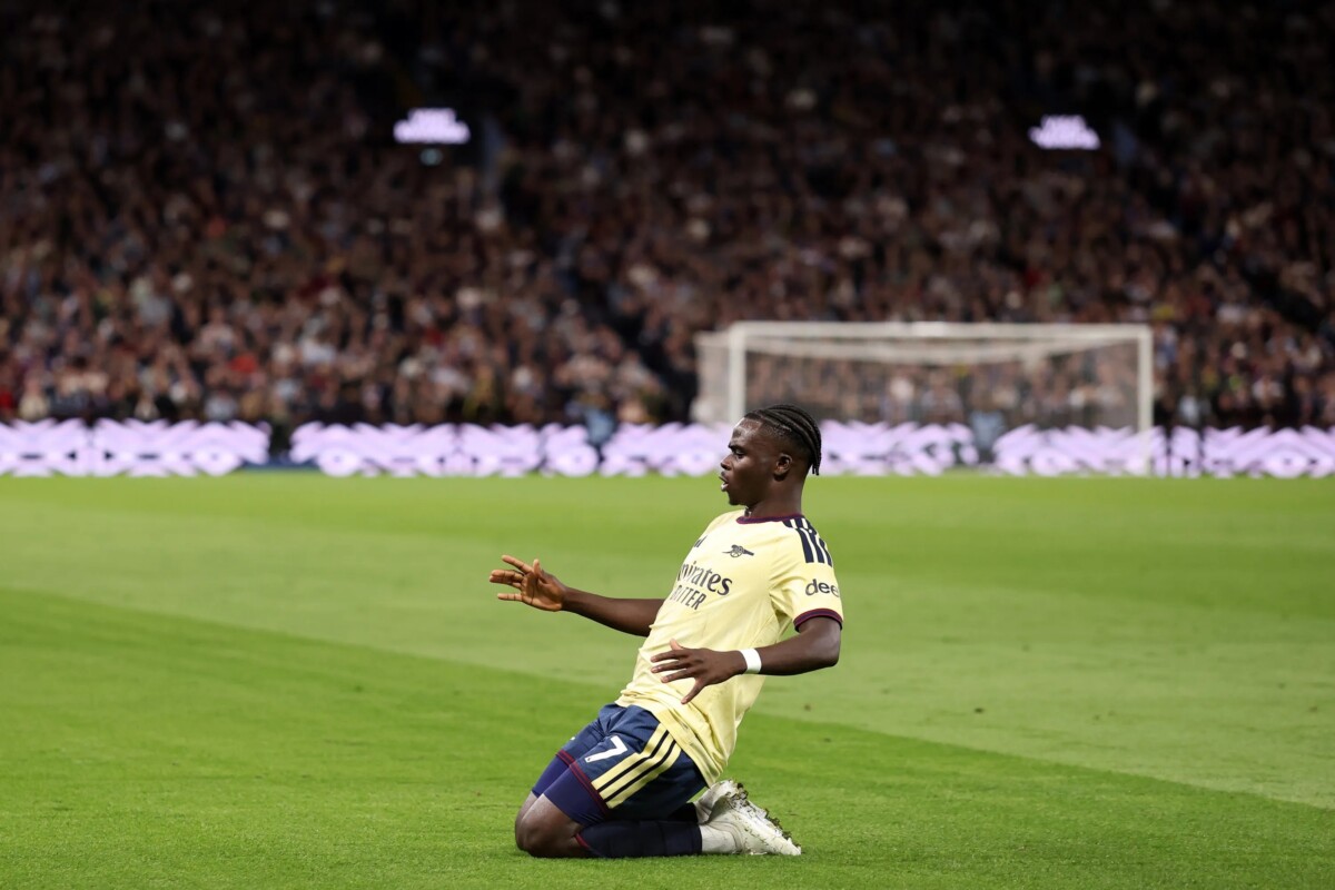 Bukayo Saka of Arsenal slides on his knees celebrating a goal at Villa Park