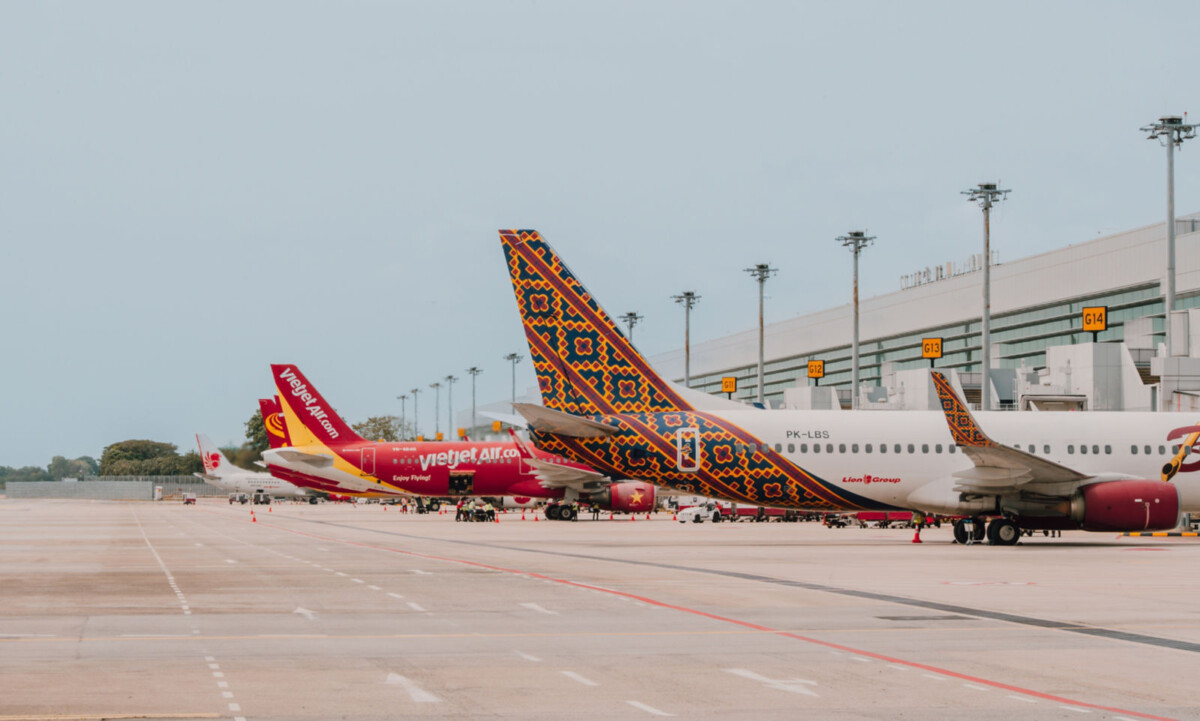 Vietjet and Batik Air aircraft parked at Changi Airport gates on the apron