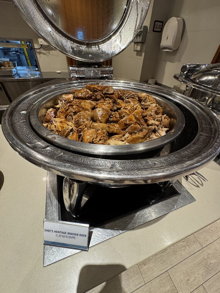 Chafing dish of Chef's Heritage Braised Duck pieces in dark braising sauce