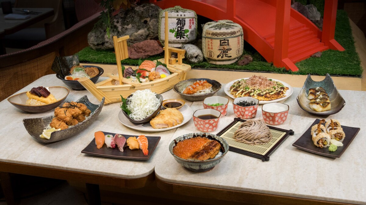 Colony Japan Week spread with sashimi boat, unagi don, okonomiyaki, soba and sushi rolls