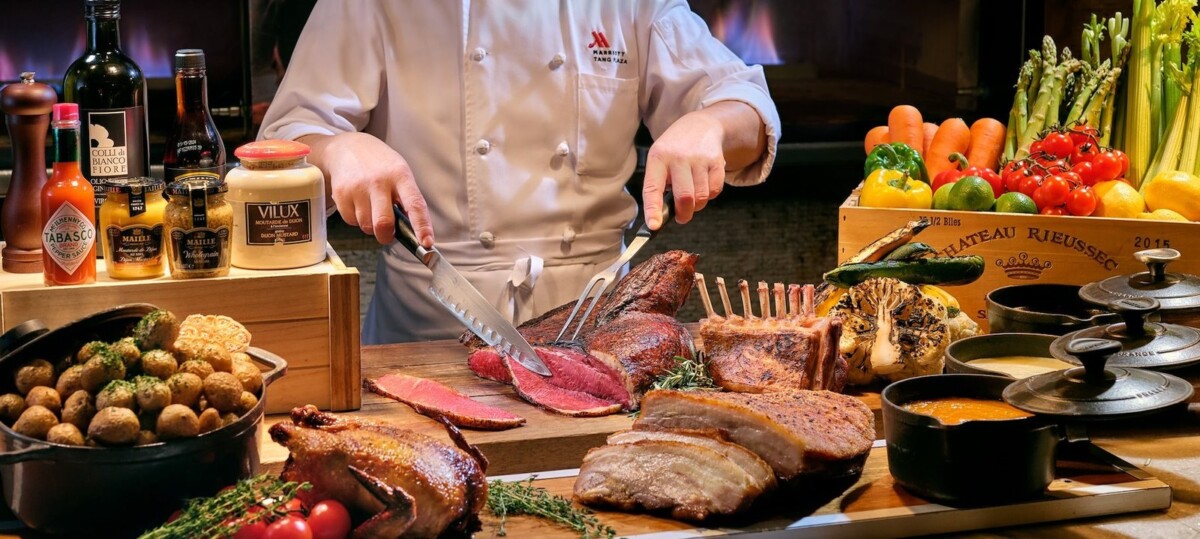 Marriott Tang Plaza chef at Crossroads Buffet live roast carving station