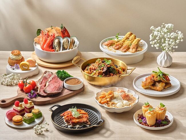 Crossroads Buffet seafood roast and dessert spread on wooden table