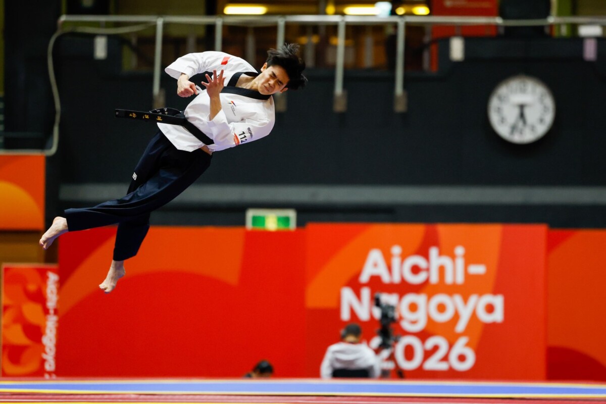 Darren Yap performs a flying kick in the men's individual poomsae final at Aichi-Nagoya 2026