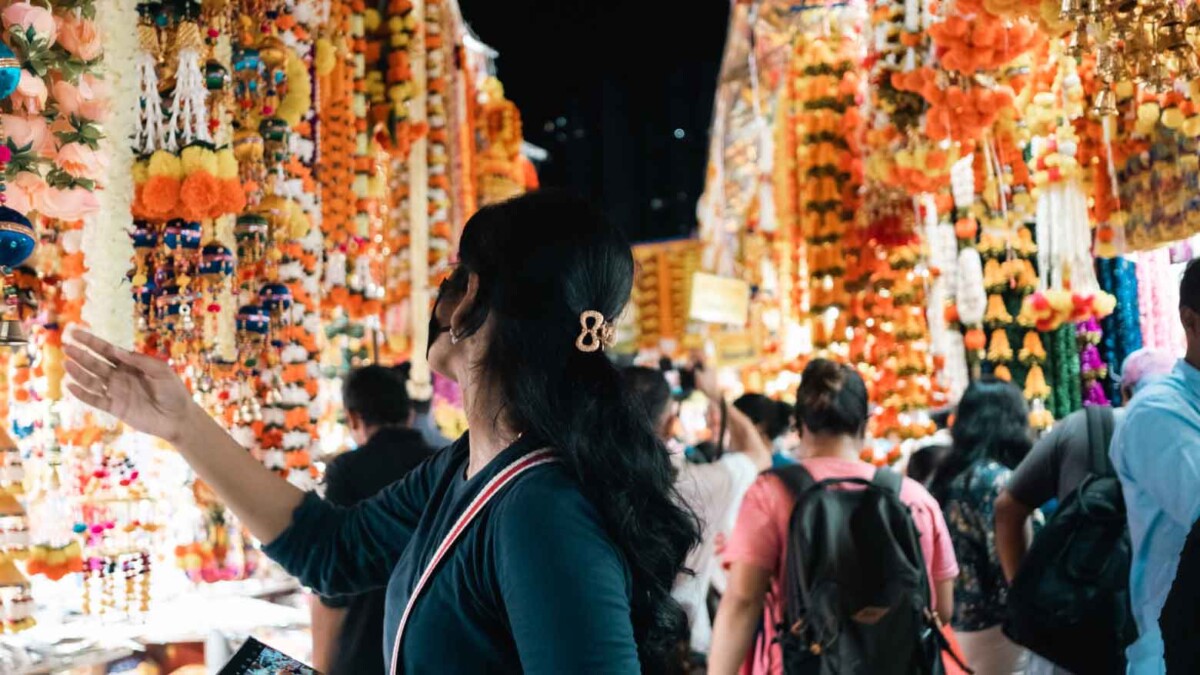Shoppers browse flower garland stalls in Little India during the Deepavali 2026 season