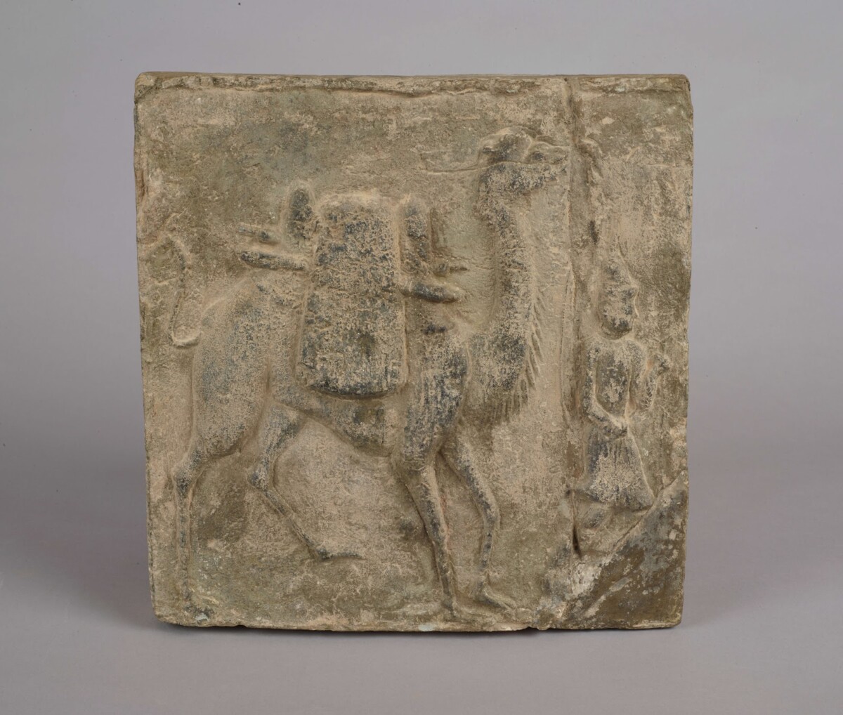 Brick depicting a Sogdian leading a camel along the Silk Road, Dunhuang exhibition at ACM Singapore