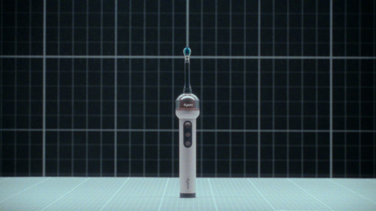 Dyson CameraJet electric toothbrush studio photograph on a grid backdrop