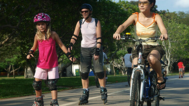 Cyclists and skaters on the East Coast Park path