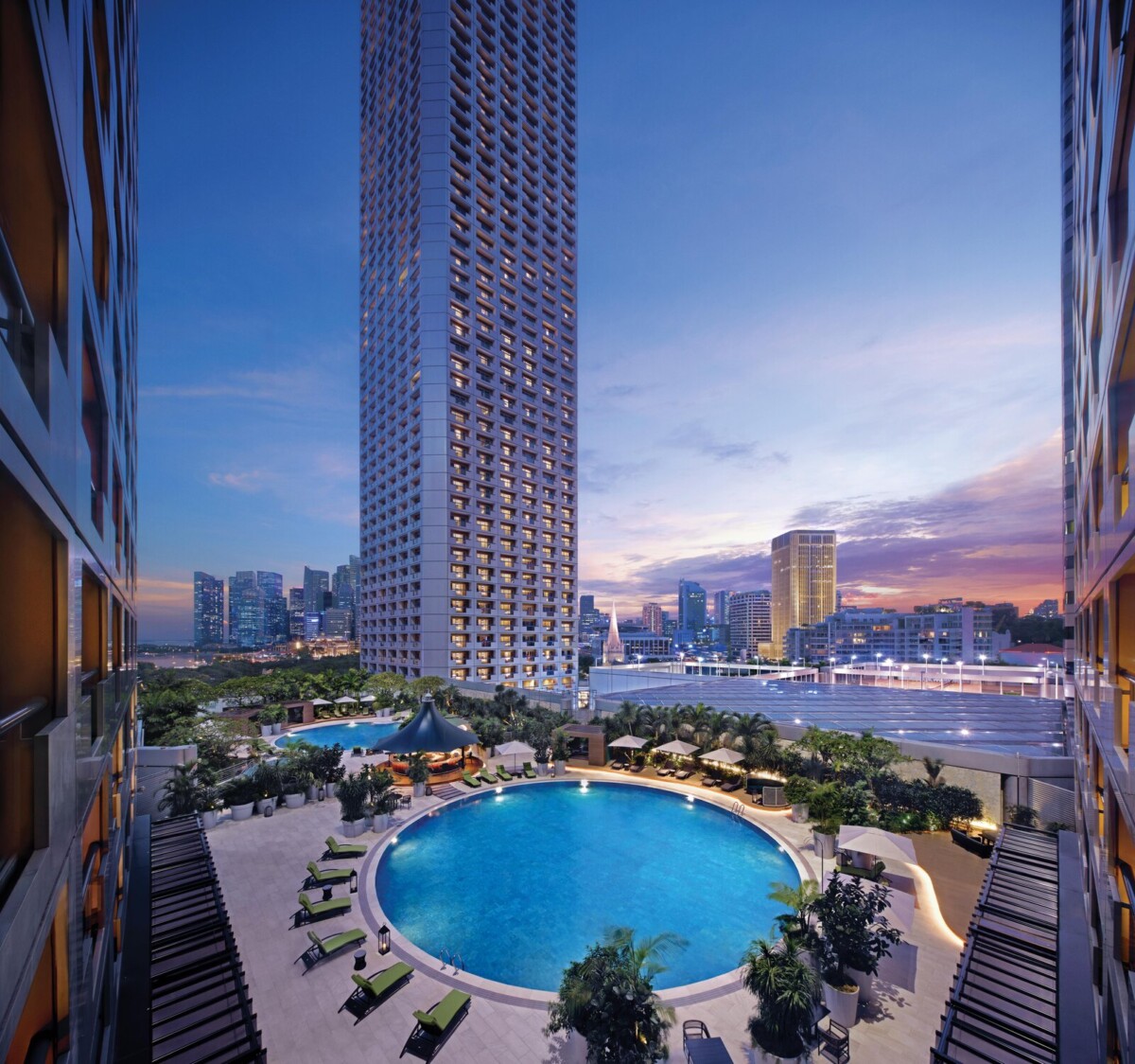 Swimming pool at Fairmont Singapore at sunset