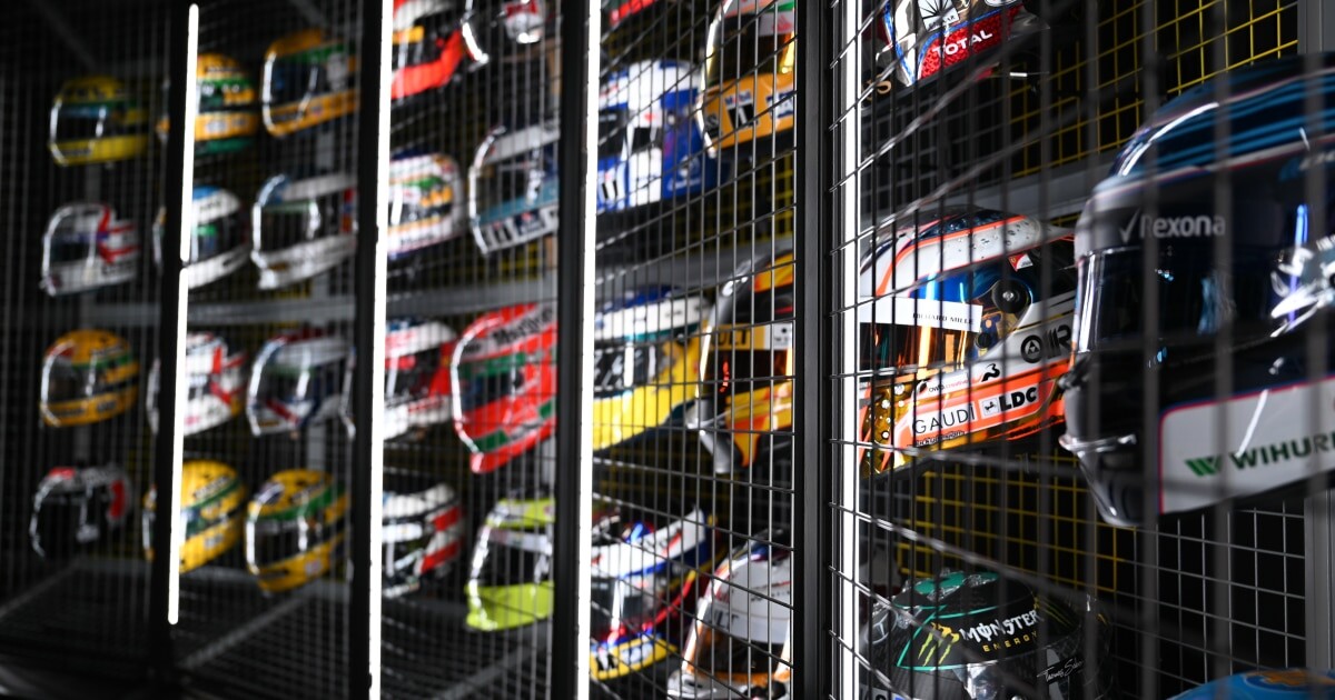 Rows of Formula 1 race helmets displayed at the F1 Exhibition in Singapore