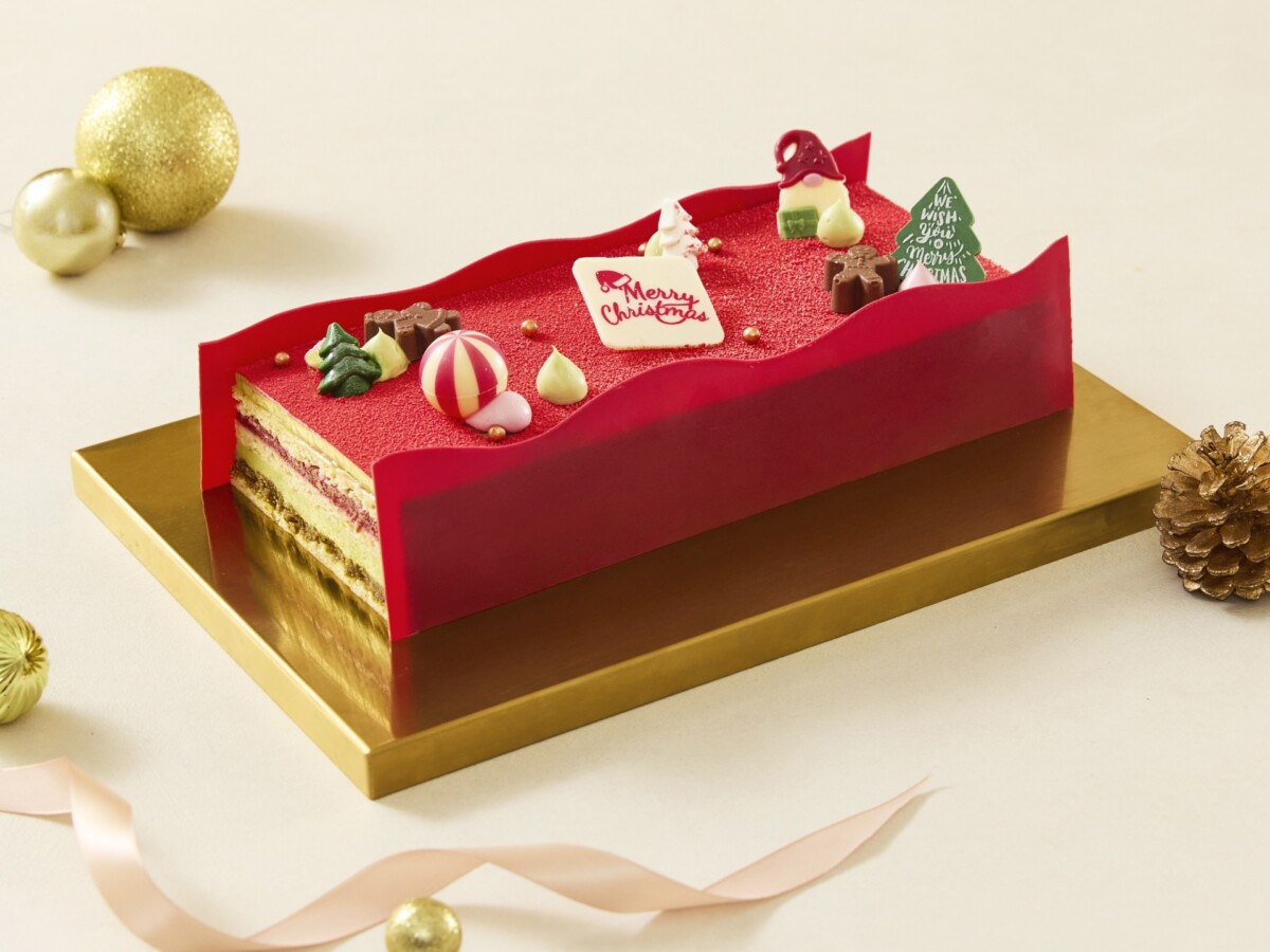 The Fullerton Pistachio and Raspberry Yule Log, a red and green layered log on a gold board