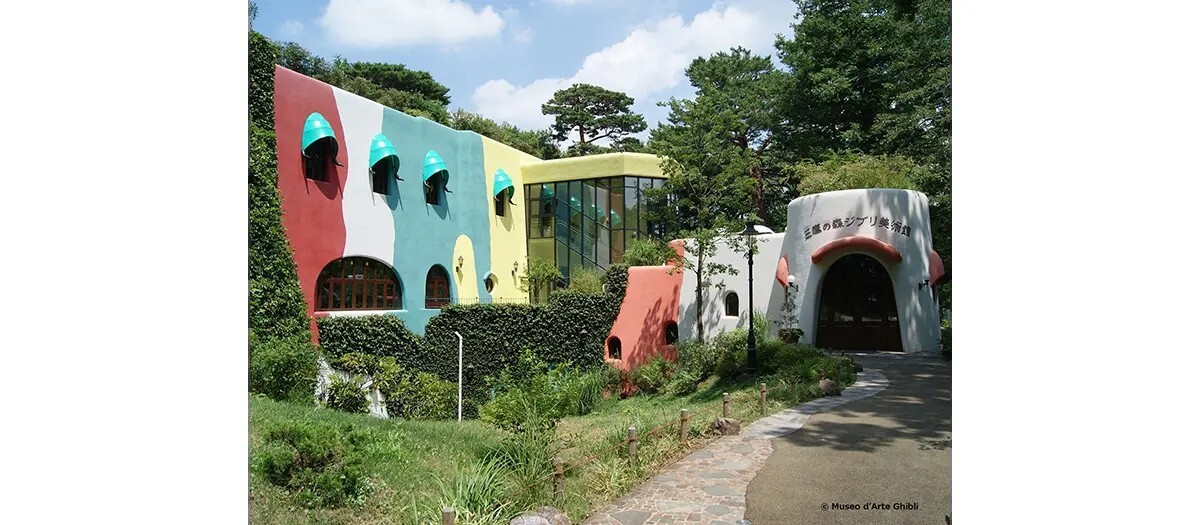 Colourful exterior of Ghibli Museum Mitaka with ivy over the entrance