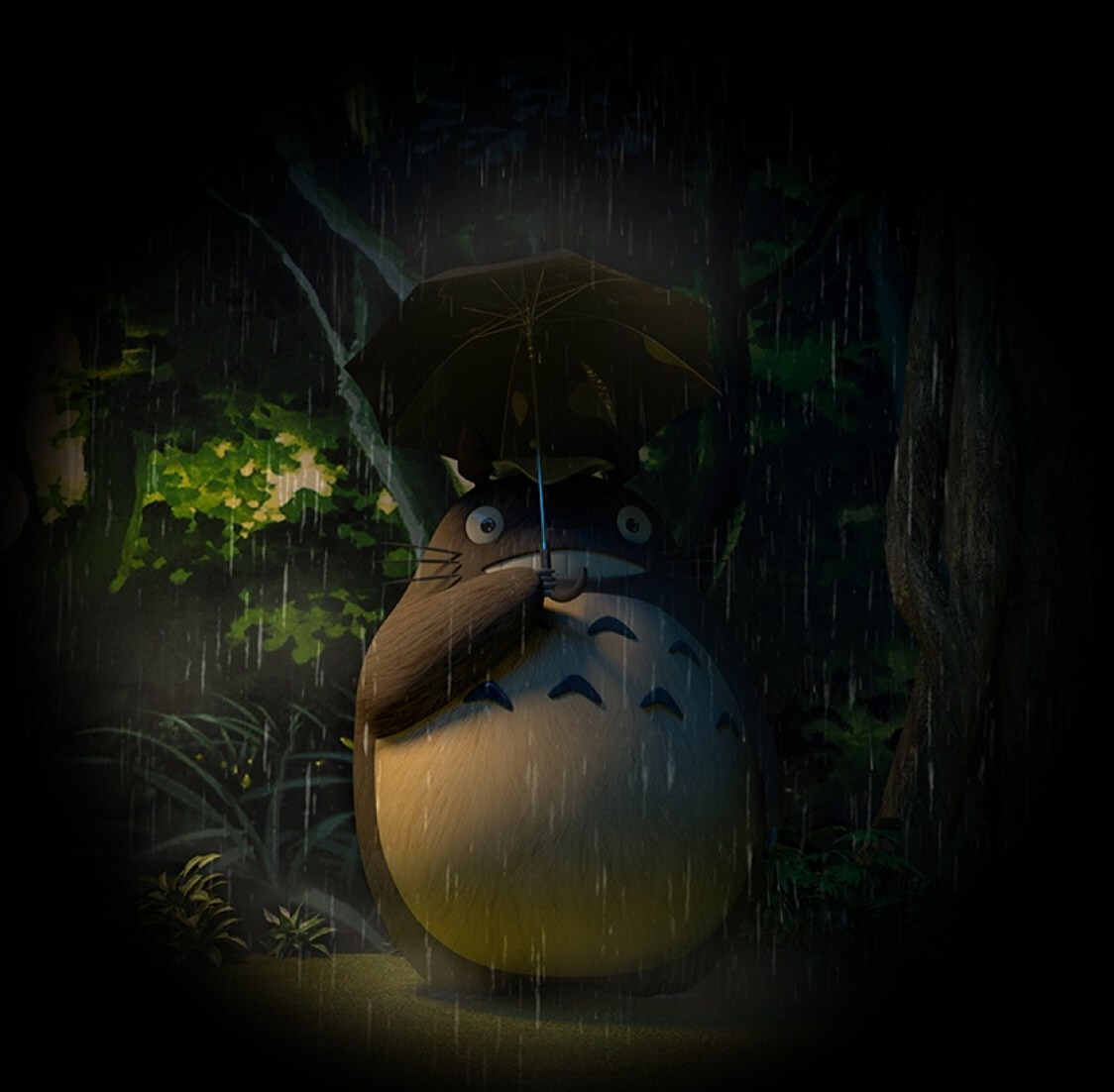 Totoro standing in the rain at a recreated forest bus stop