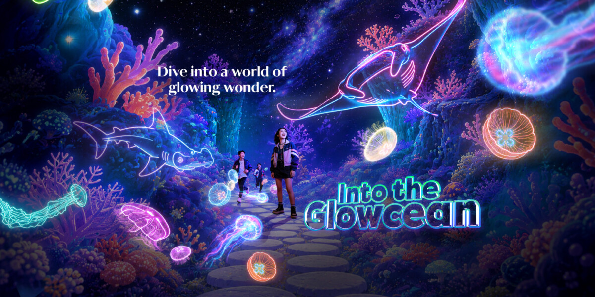 Into the Glowcean key visual with glowing neon marine life at Singapore Oceanarium