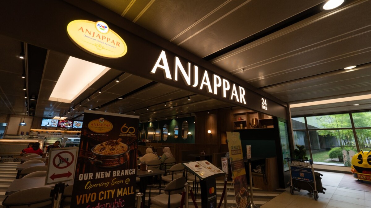 Anjappar restaurant entrance at Changi Airport, offering a free kids meal with two adult mains