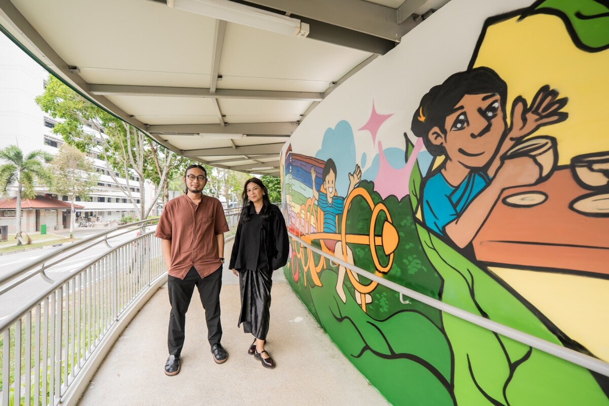 Guests beside the HAN@Mountbatten community mural