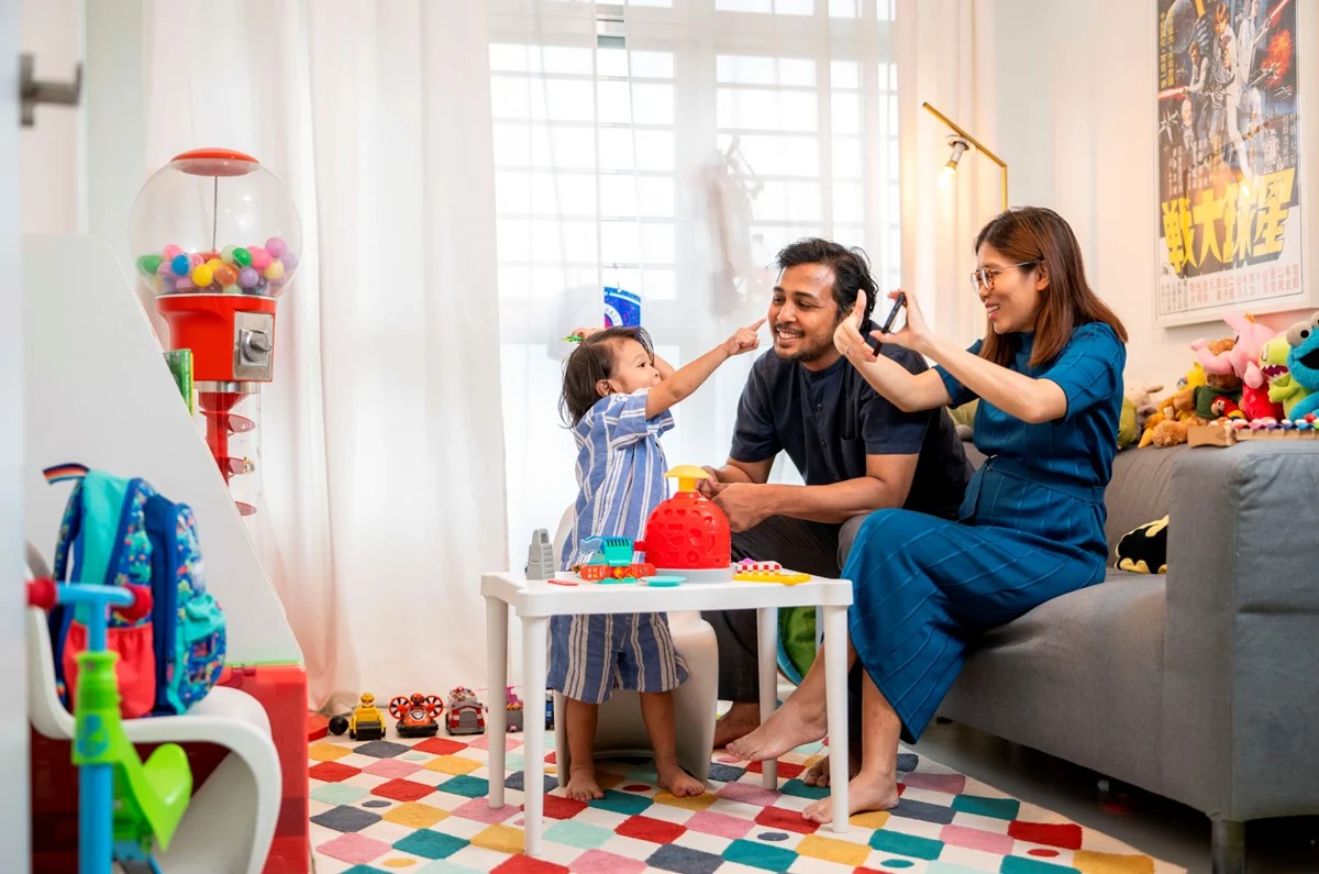 Family with a young child in an HDB flat, illustrating the extra BTO ballot chance per child