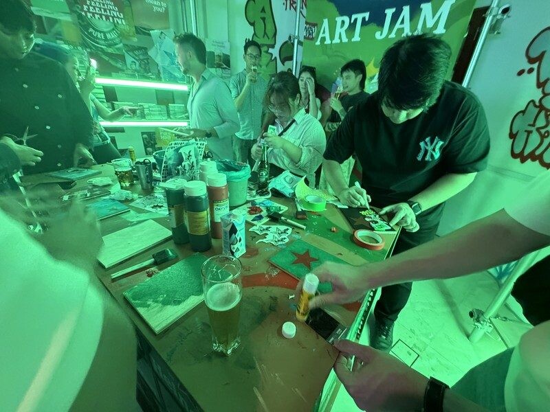 Guests cutting and layering at the Art Jam station at Heineken First Sip House