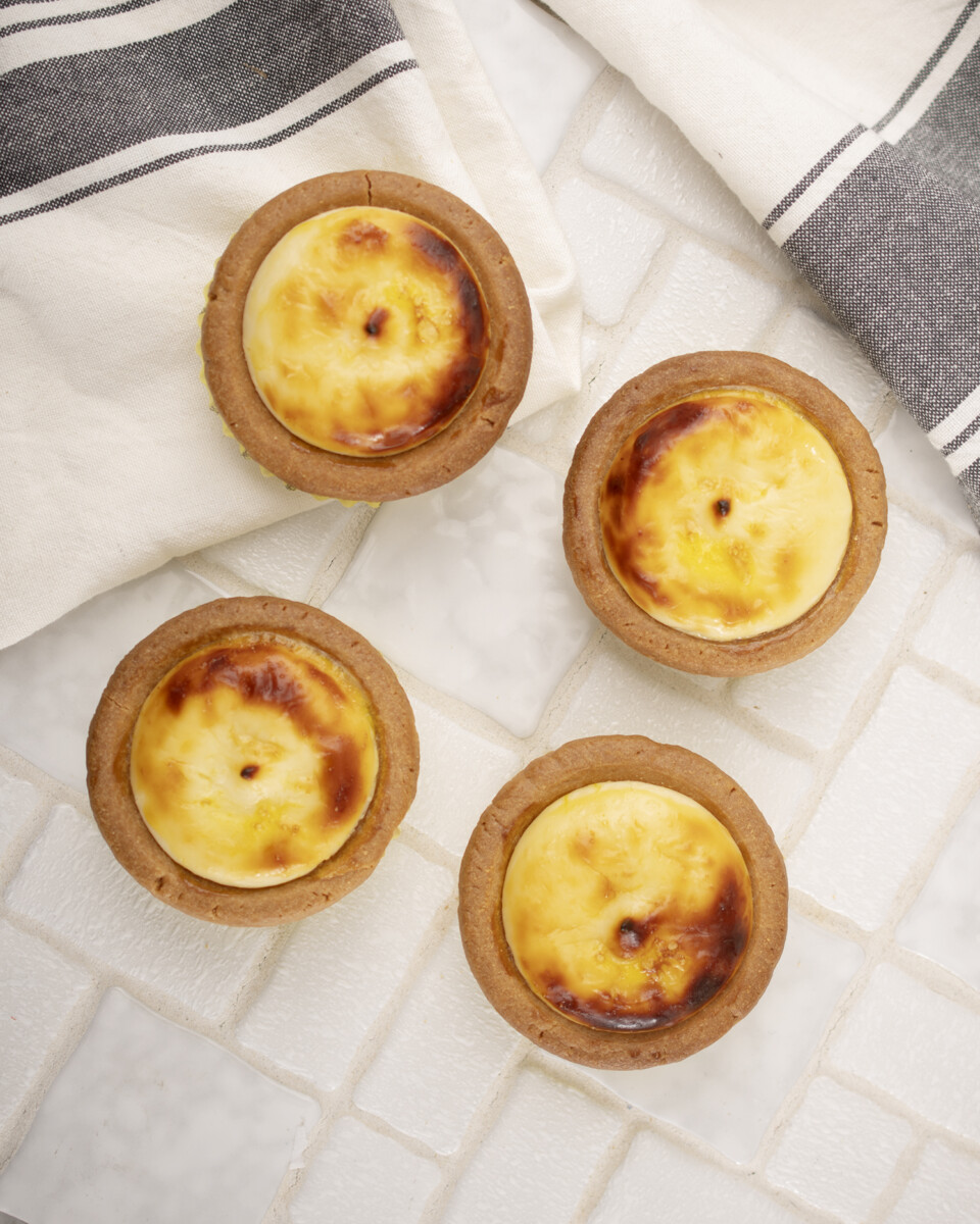 Four Original Cheese Tarts on white tiles from Hokkaido Baked Cheese Tart