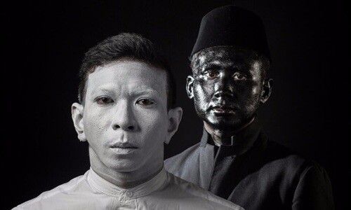 NADA, the performing duo, in white and black body paint