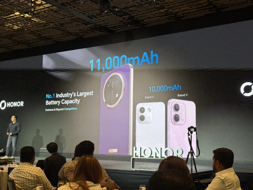 HONOR stage slide comparing the X9e Pro 11,000mAh battery with two 10,000mAh rival phones