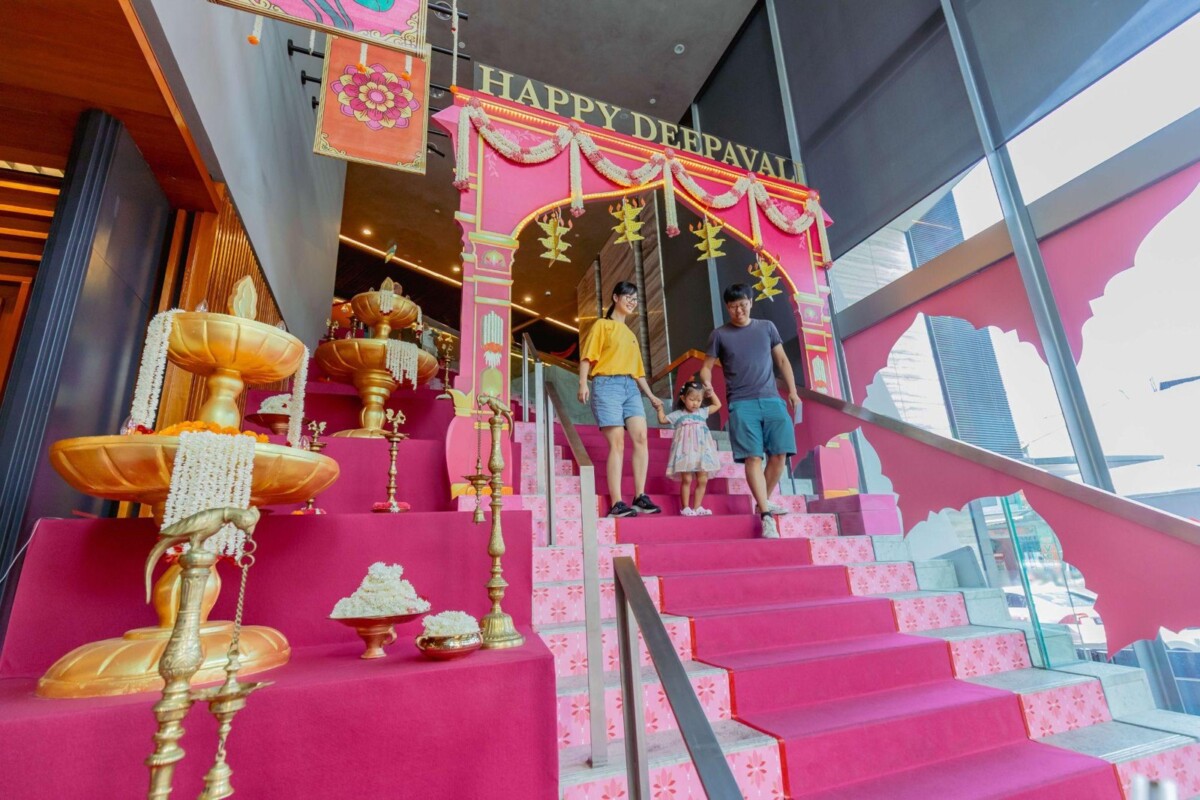 Pink decorated staircase and brass lamps in the Level 1 lobby of the Indian Heritage Centre for Deepavali Open House 2026