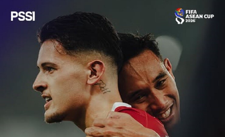 Indonesia players embrace after reaching the FIFA ASEAN Cup final in Jakarta