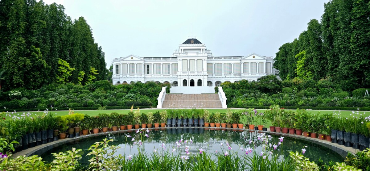 The Istana main building seen across its lawns and a reflecting pool