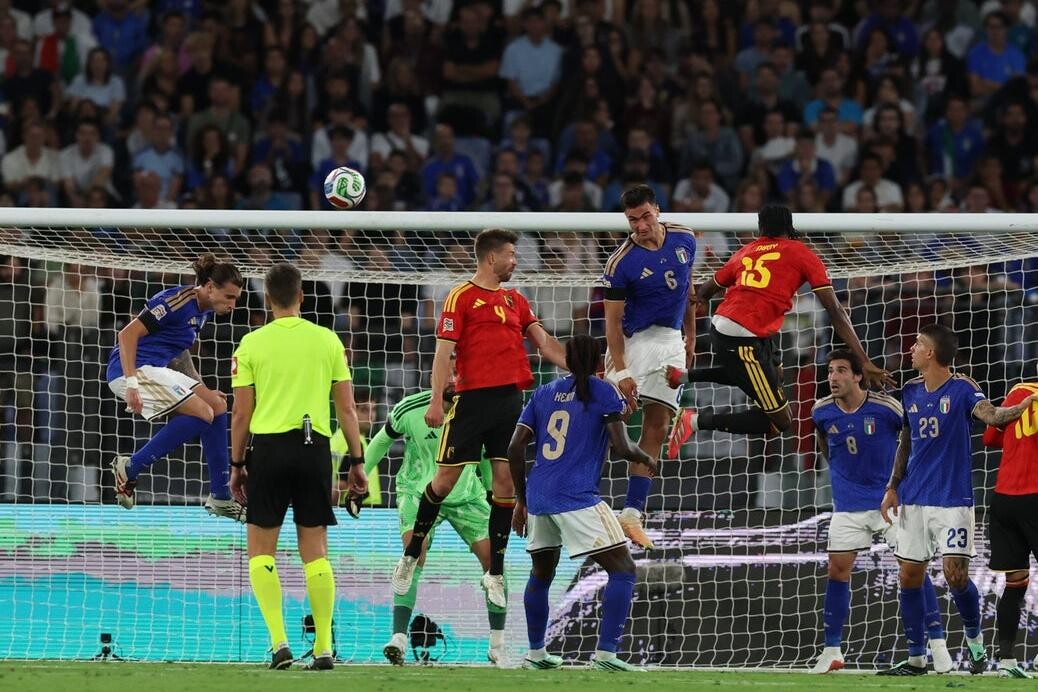 Belgium players contest a ball in the Italy box at Stadio Olimpico