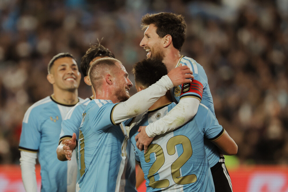 Messi celebrates with Argentina team-mates during the 3-0 win over Benin in Buenos Aires
