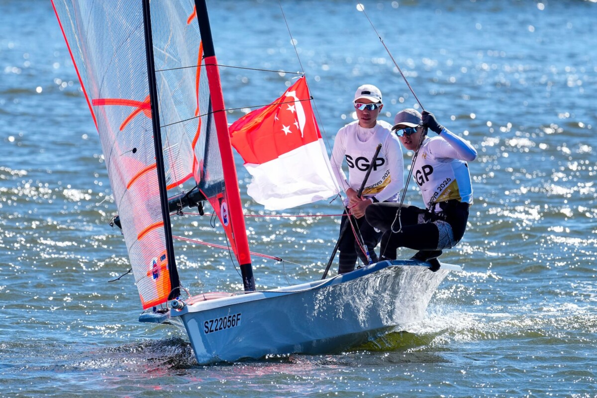 Sean Kum (left) and Nigel Tan fly the Singapore flag from their 29er at Kaiyoh Yacht Harbour.