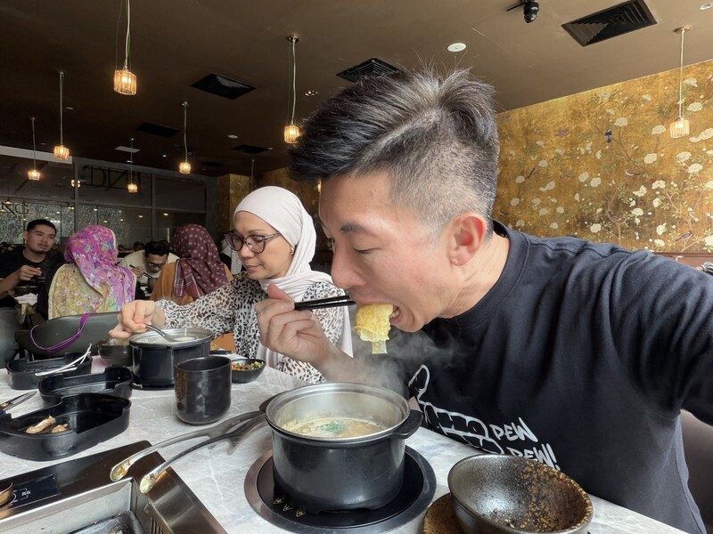 Gold floral mural wall and bean curd roll moment at JING Halal Hotpot and Grill